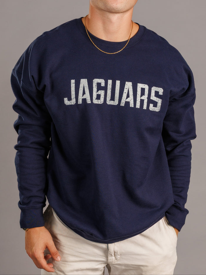 Navy men's crewneck sweatshirt featuring Augusta University Jaguars logo by Arena Graffiti, laid flat on a white background.