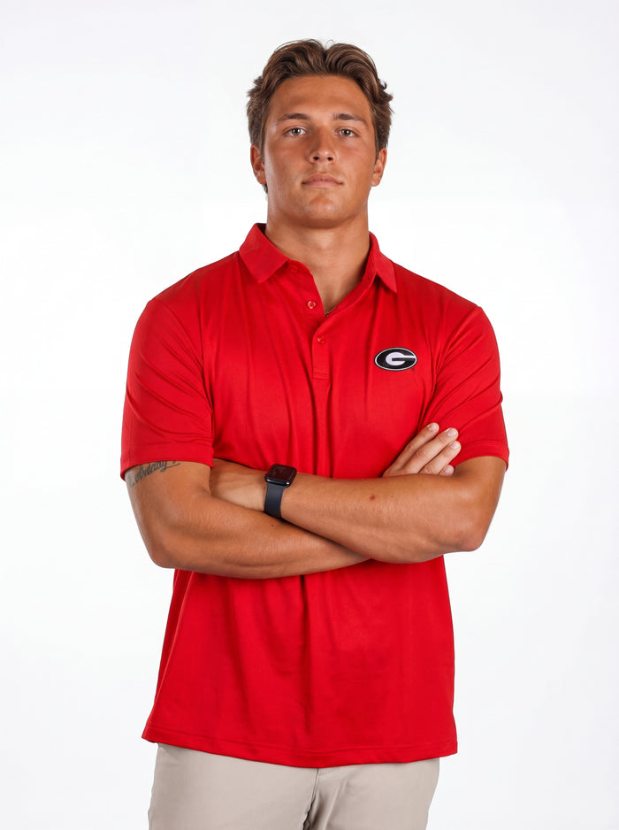 UGA Bulldogs men's red "Hedges" polo shirt by Arena Graffiti, featuring the team logo and classic collar design.